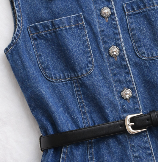 Blue denim dress with a black belt on a white background