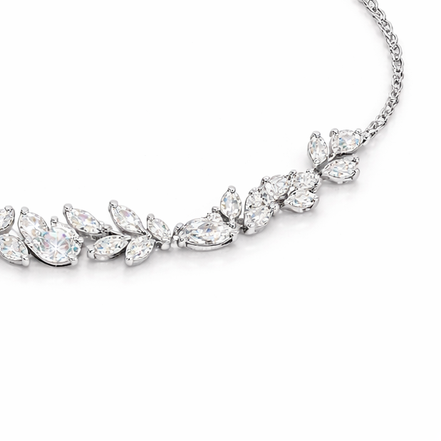 Silver bracelet with leaf-shaped crystals on a white background